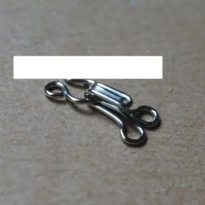 Copper Spring Collar Hook Button on the Invisible Underwear detail view 3