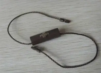 Hang Tag Seal with Thicker String Thread and Plastic detail view 3