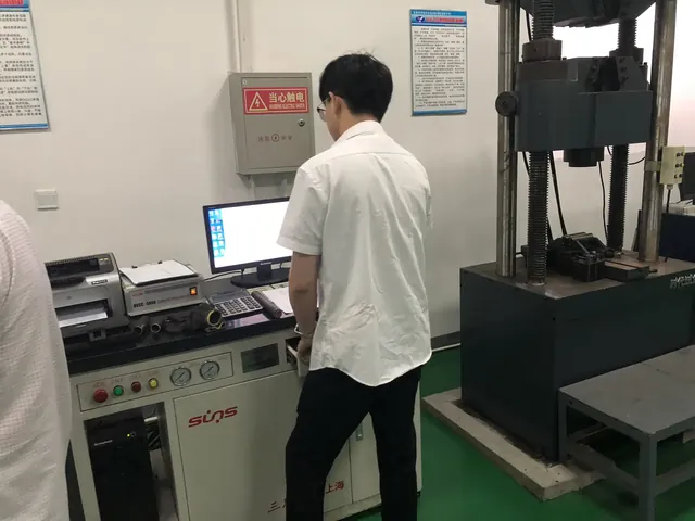 Operator running a test on the universal testing machine