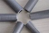 Extruded bimetal fin tube with the fin formed from an aluminium sleeve