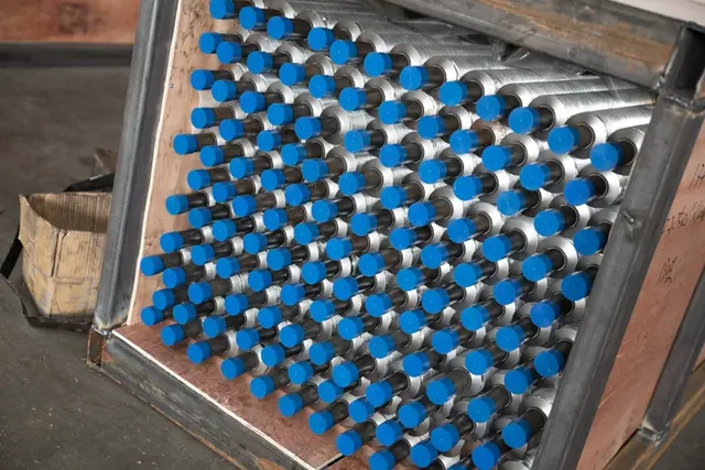 Extruded fin tubes stacked in the workshop