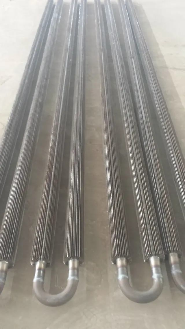 Longitudinal finned tube element for tank heating duty