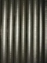Integral low fin tube with the fin rolled from the tube wall