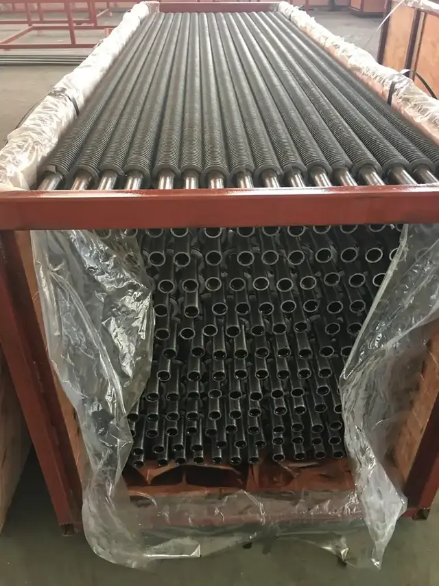 Spiral finned tubes prepared for bank assembly