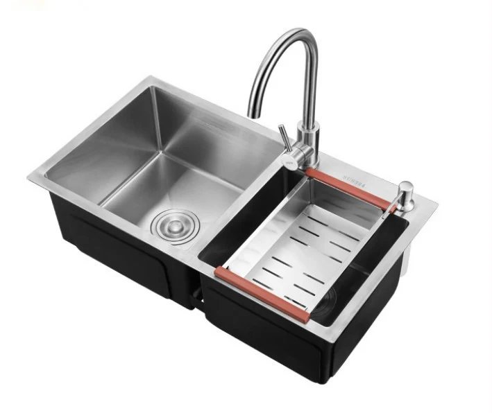 Double bowl topmount sink fitted with a drainer rack and colander