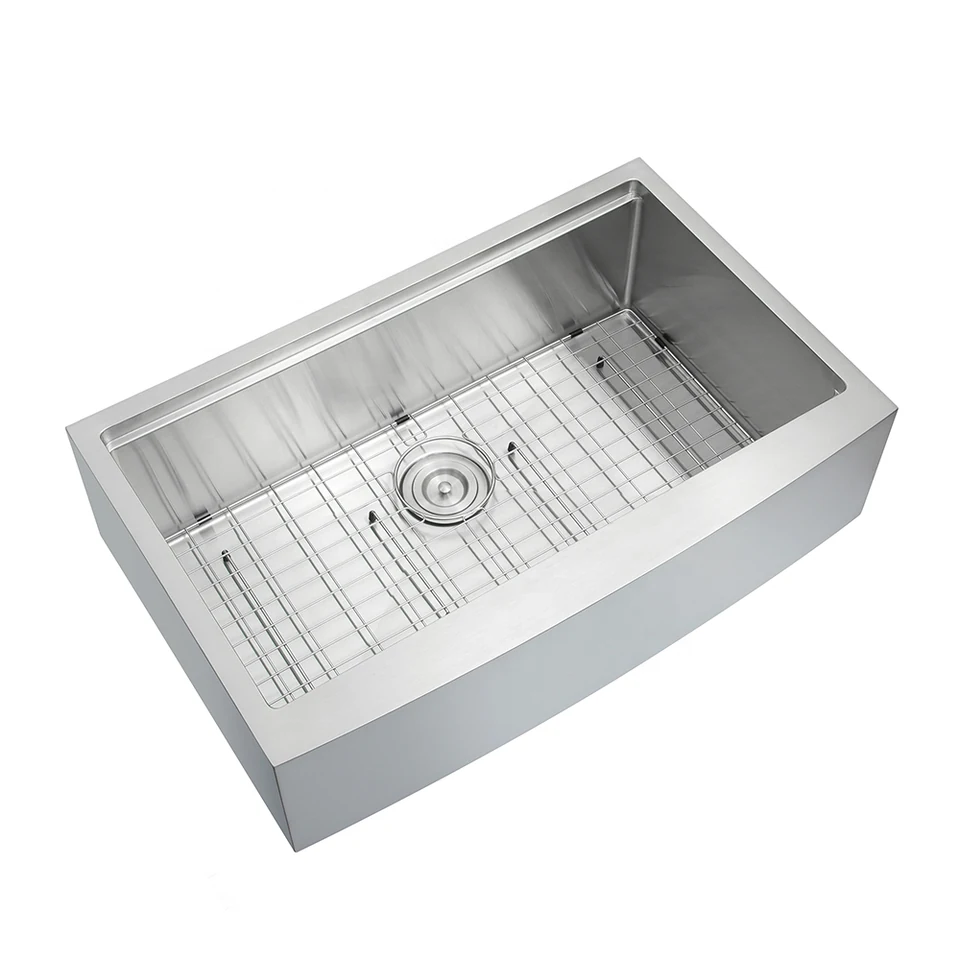 Single bowl farmhouse apron sink with a curved front and a bottom grid