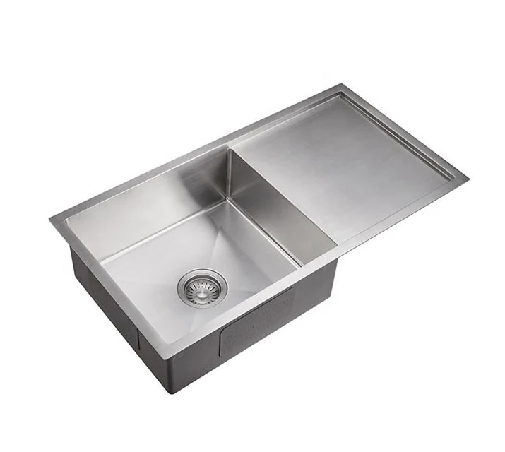 Stainless steel sink with an integrated ribbed drainboard