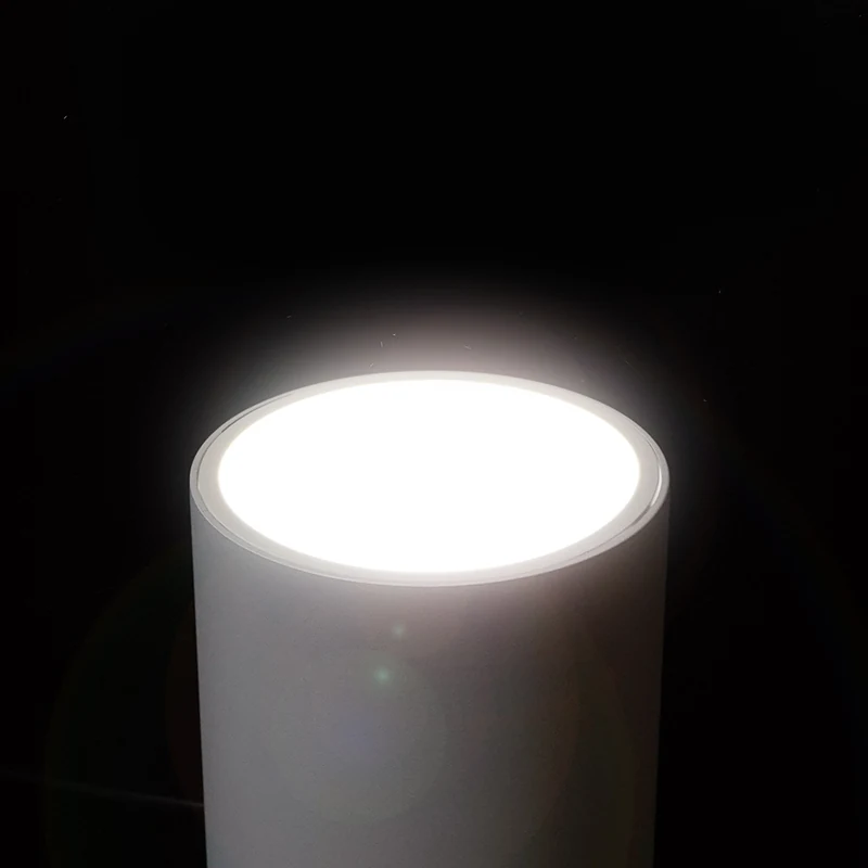 Recessed LED down light installed in a commercial office ceiling with 0-10V dimming system
