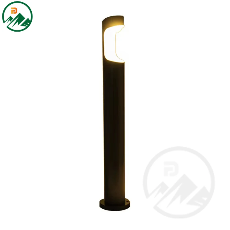 Tall garden light mounted on a post, illuminating a garden bed at night