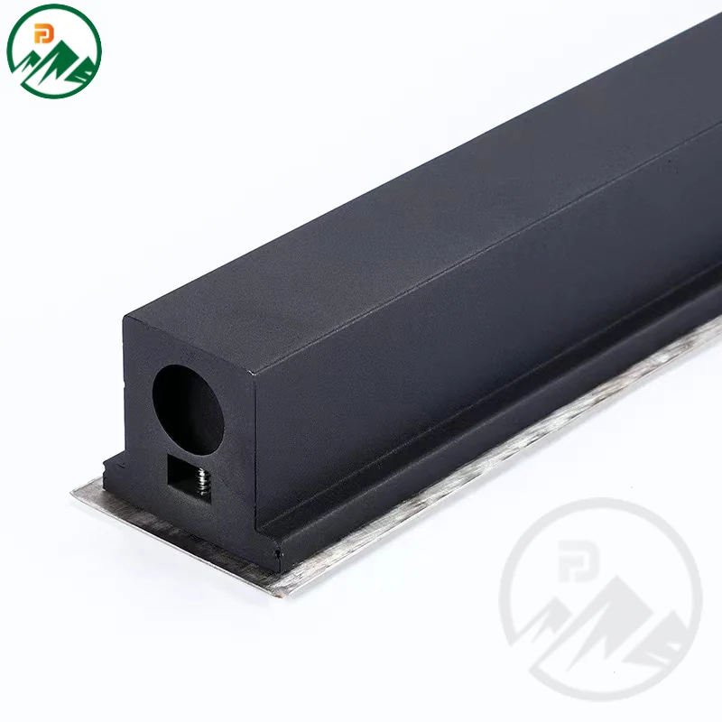 Linear underground light used in a landscape setting to define a garden path edge
