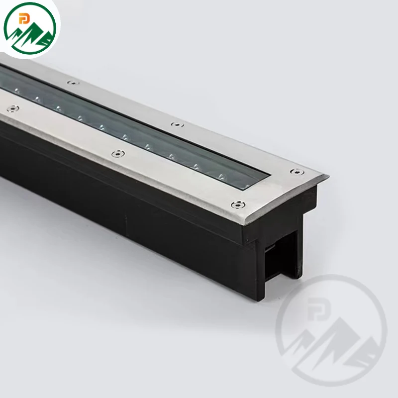 Close-up of the stainless steel 304 cover and LED array on the linear in-ground fixture