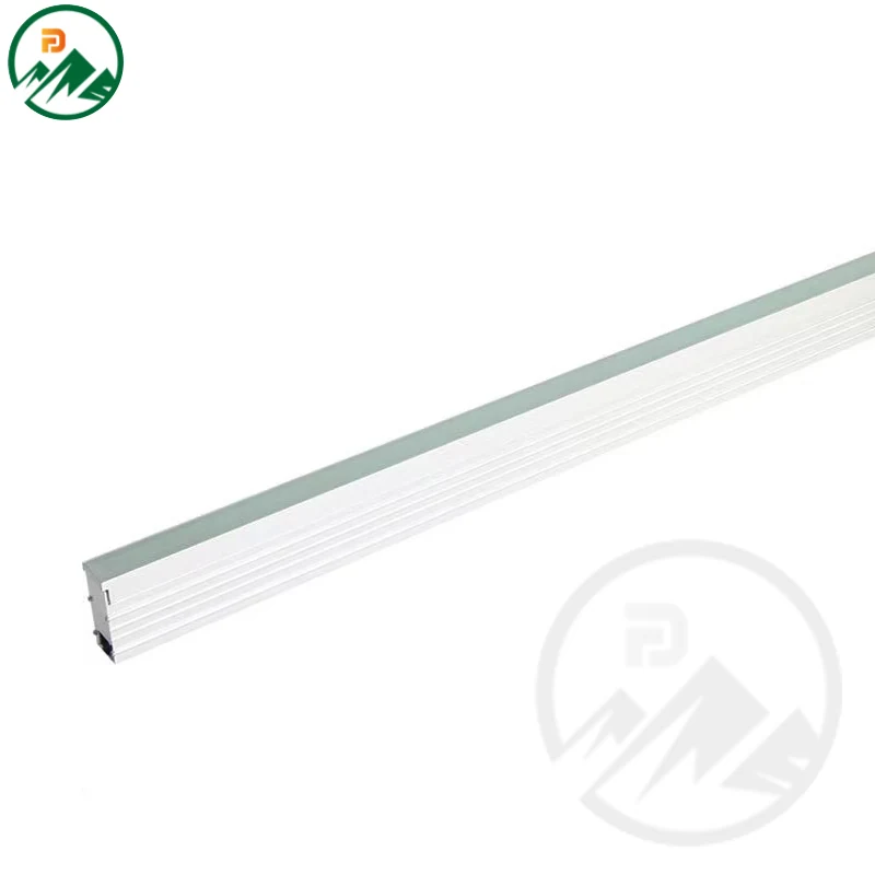 Linear underground light installed flush in paving with frosted glass cover