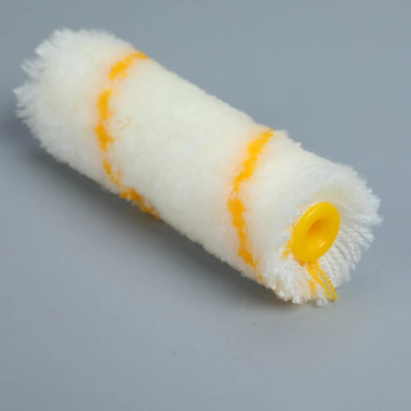 White mini paint roller cover with yellow stripes and a yellow plastic core end