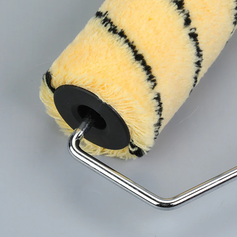 9 inch yellow tiger stripe acrylic paint roller cover on neutral background