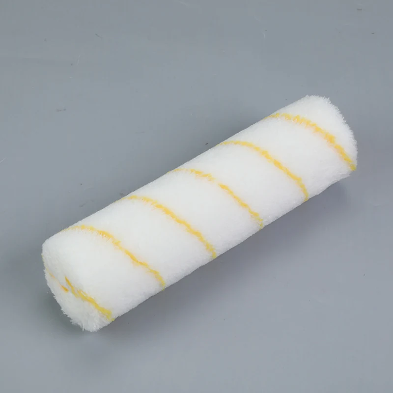 9 inch white roller cover with yellow diagonal stripes on a grey background