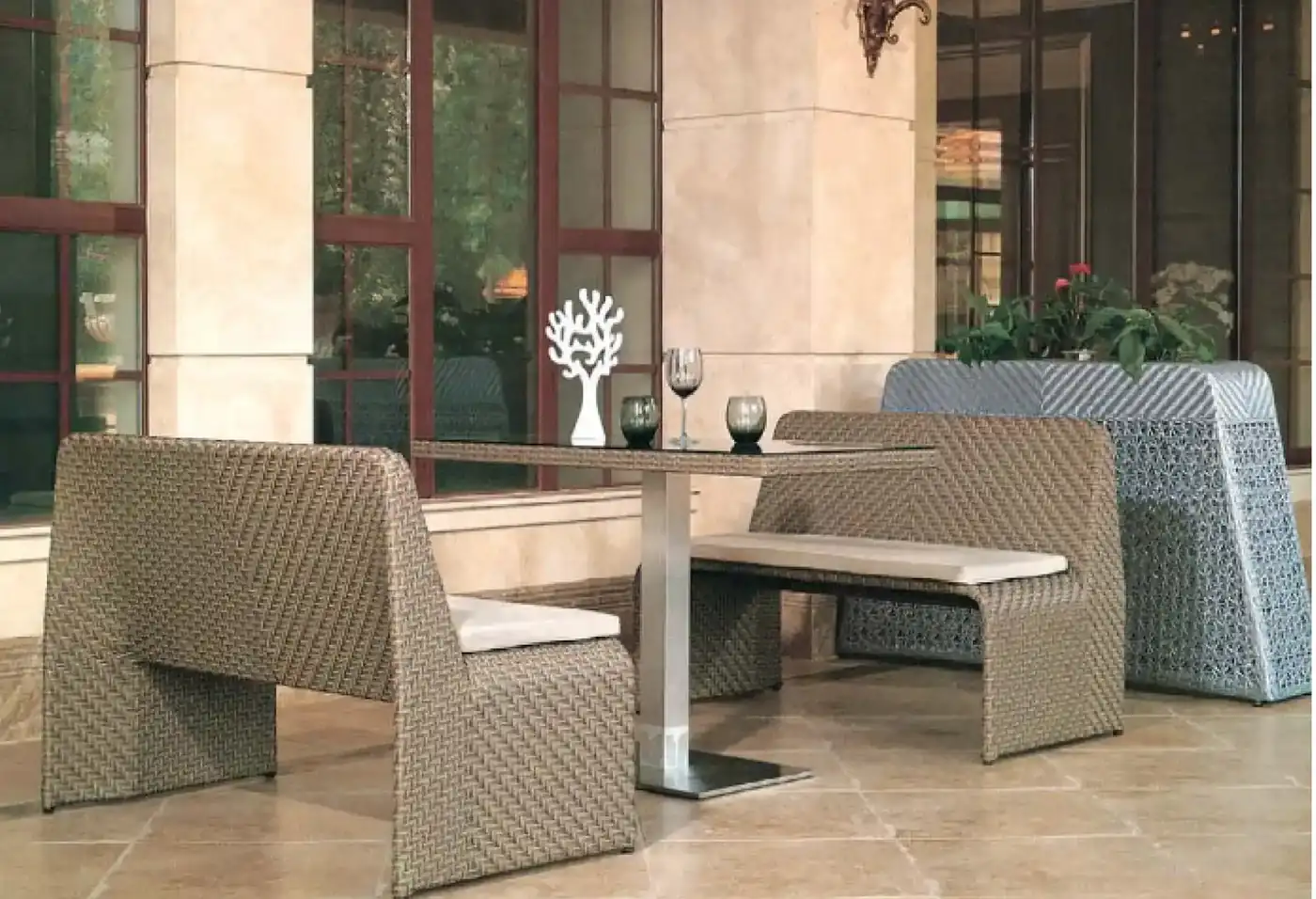 Rattan outdoor dining booth set in beige with bench seating and centre pedestal table