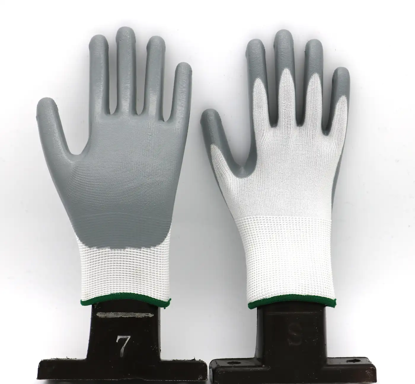 Pair of grey smooth palm coated work gloves with white knitted liner and elasticated cuff