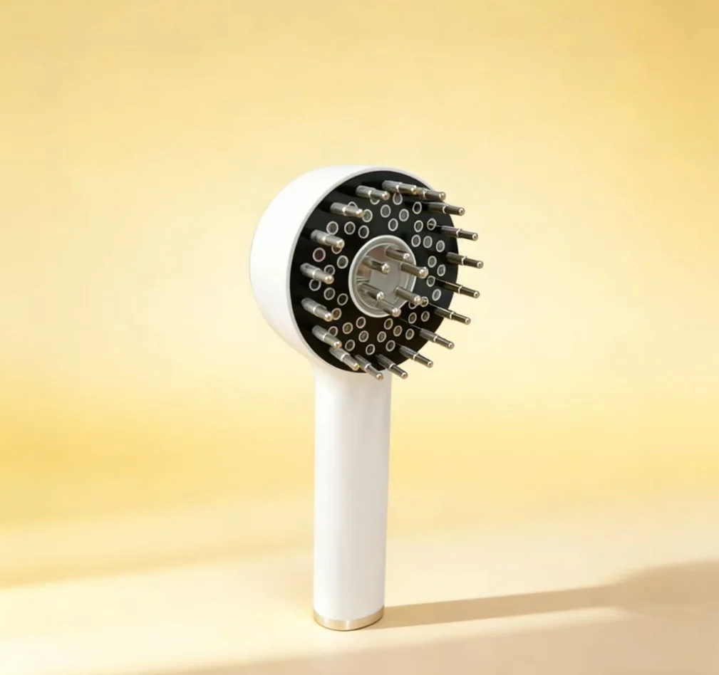 4-in-1 laser scalp therapy comb in use on a person's head