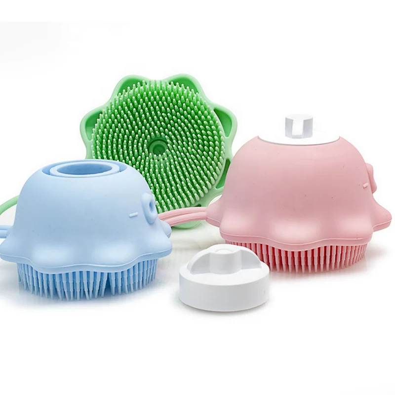 Silicone baby bath brush with built-in shower gel reservoir in use during bath