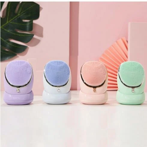 Rechargeable silicone facial cleansing brush in use on the face