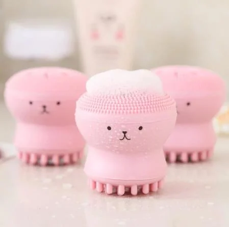 Silicone facial cleaning brush with octopus shape in use on the face