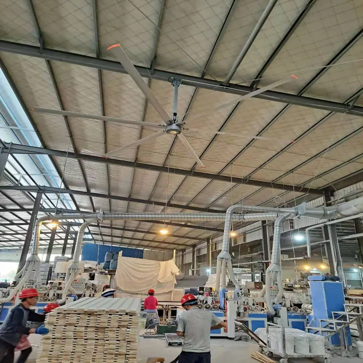 Six-blade HVLS fan in a wood-processing workshop