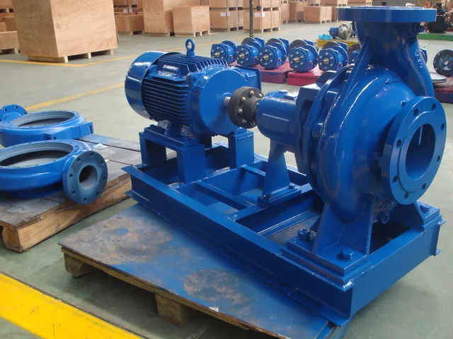 Blue FA series end-suction pump set with motor on a pallet beside spare casings