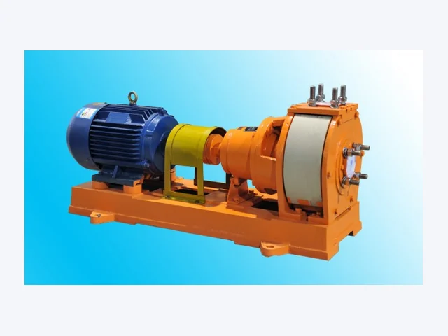 Lined centrifugal pump with motor, spacer coupling and orange armour casing on a baseplate