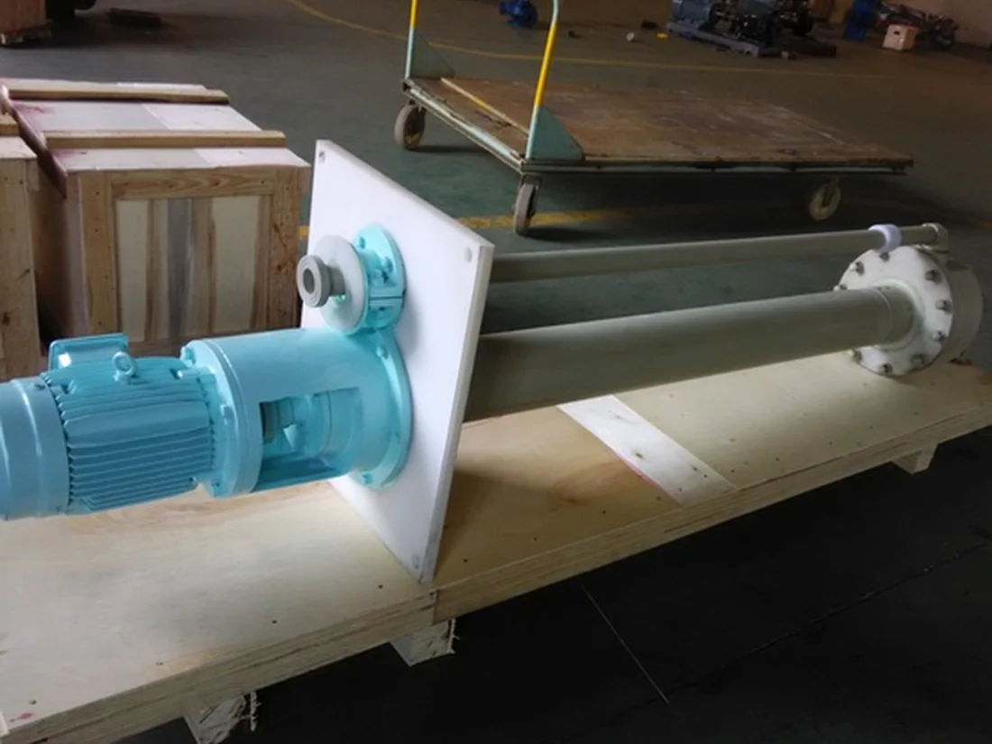 Teal vertical sump pump packed on timber bearers ready for crating