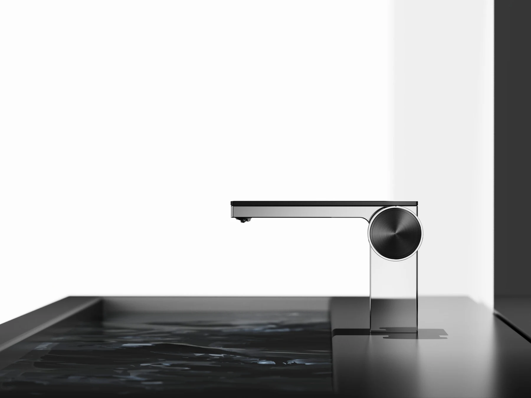 Funmax chrome sensor basin mixer over a dark stone basin