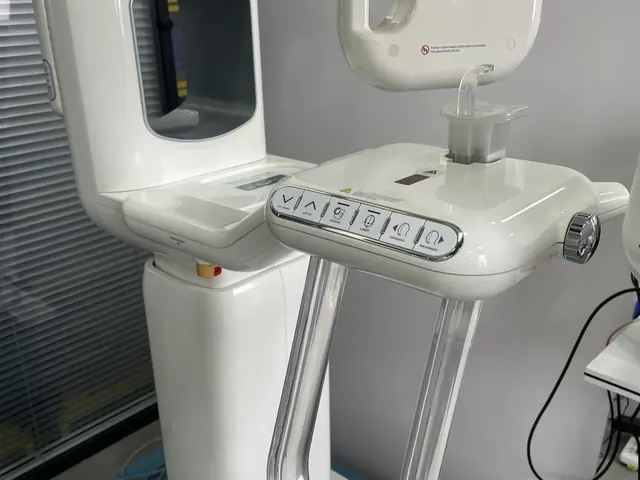 Genoray PAPAYA Plus side view showing patient positioning area, chin rest post and bite stick