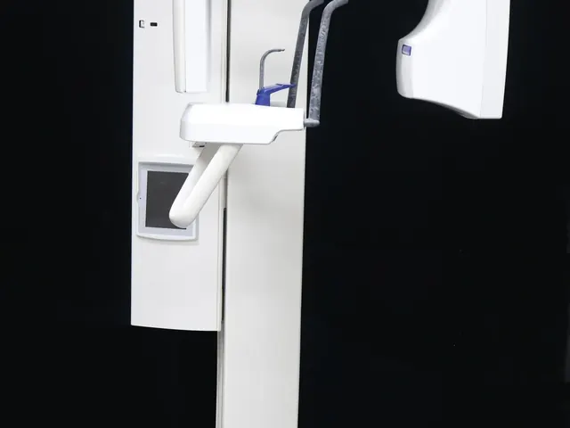 Side-mounted colour touchscreen control panel on the Planmeca ProOne column showing program selection interface