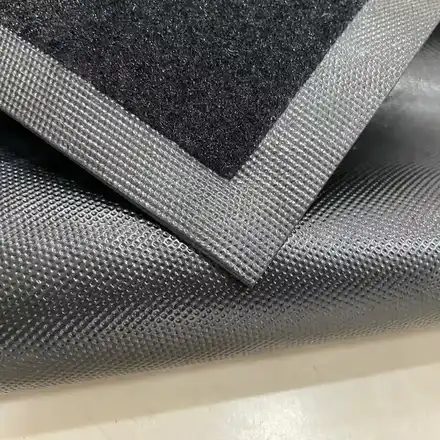 Rolled motorcycle mat prepared for shipping