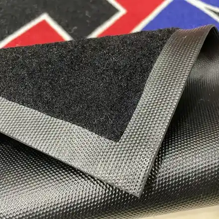 Work mat rolled up showing the anti-slip backing