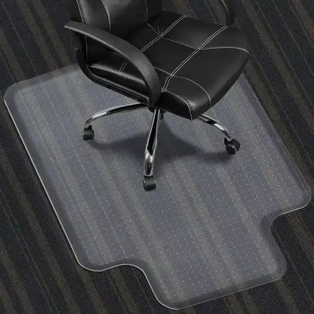 Lip shape PVC chair mat on carpet with the tongue under a desk