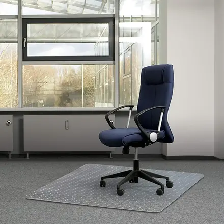 Rectangular PVC chair mat laid on office carpet