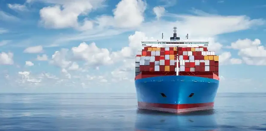 Container vessel fully loaded and under way on open water