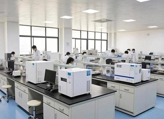 Technicians running instrument tests at laboratory benches