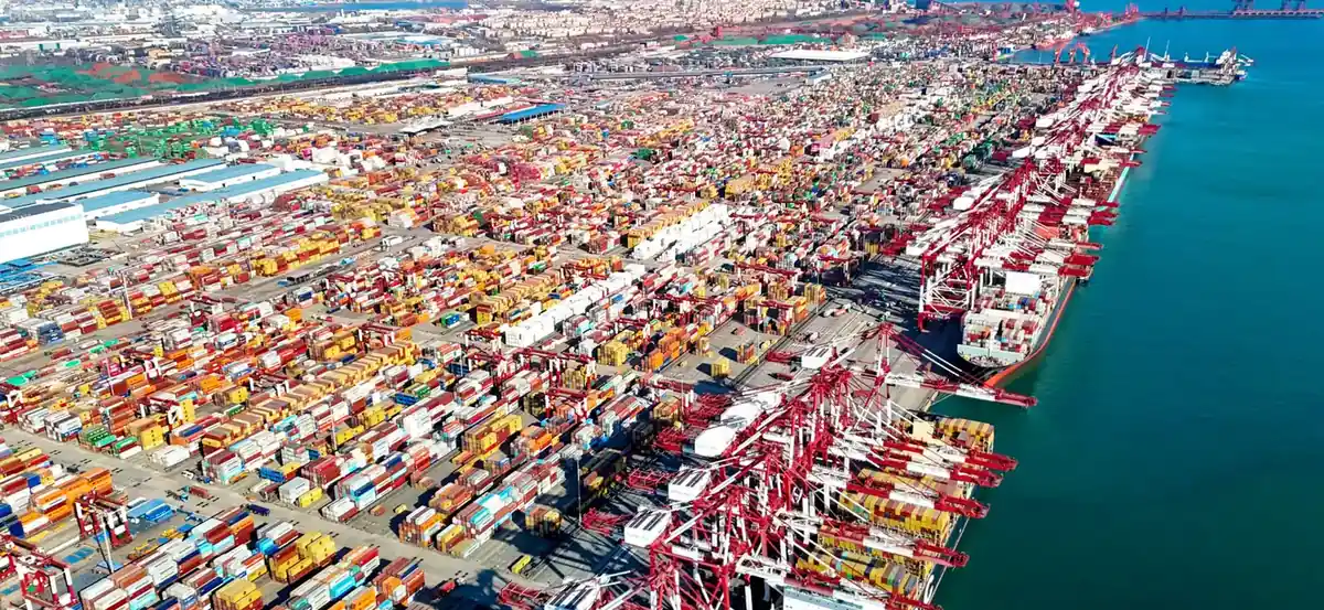 Aerial view of a Chinese container terminal with gantry cranes loading vessels