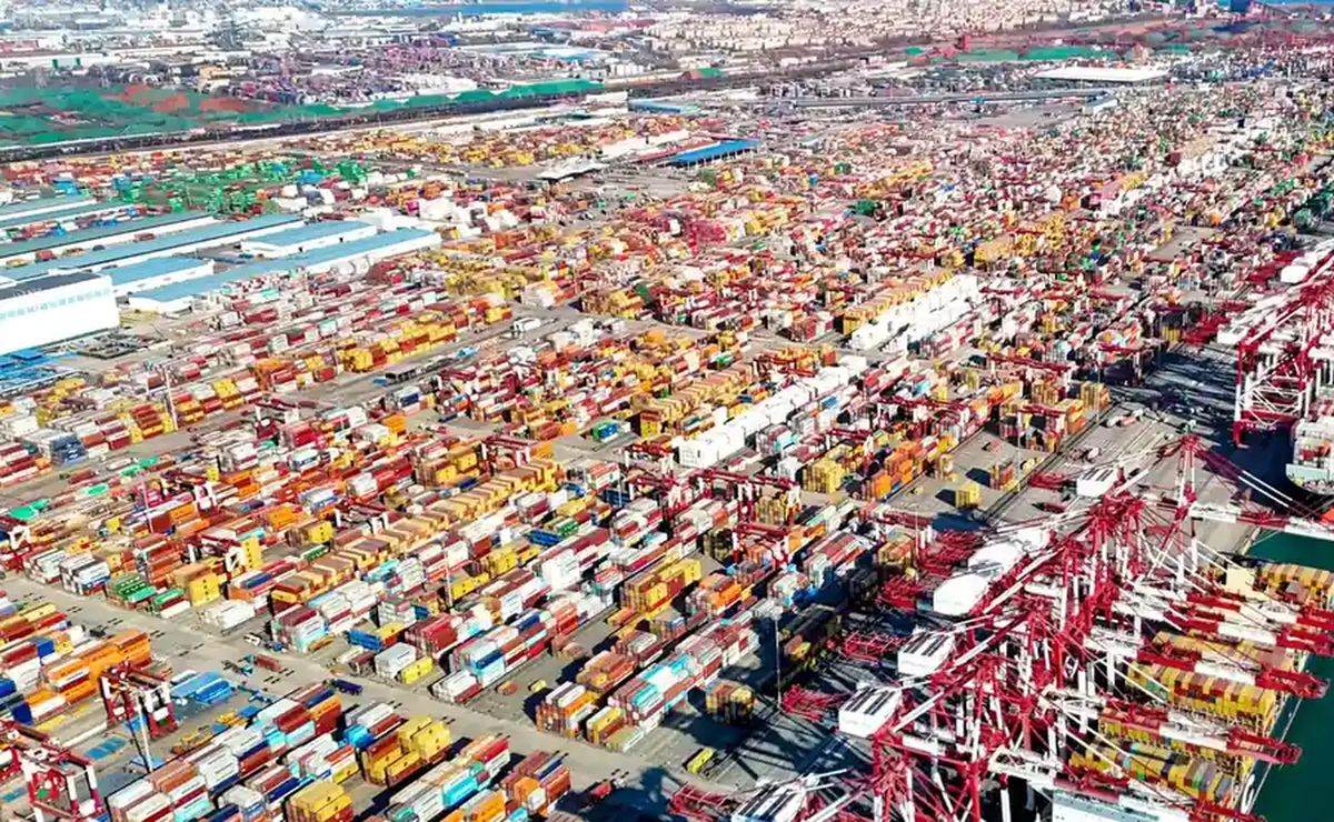 Aerial view of a container terminal stacked with shipping containers