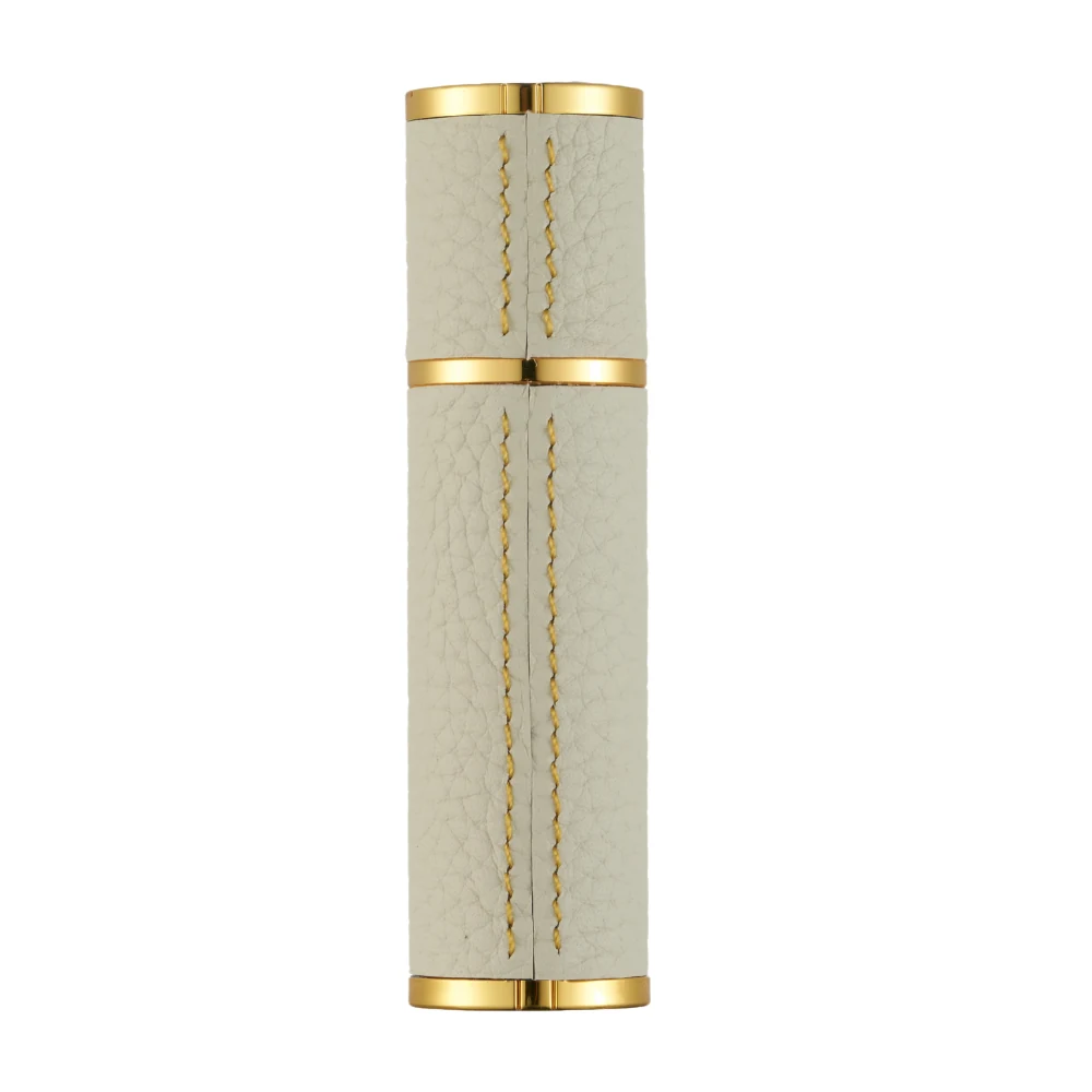 GOOD Magnet Series 5ml Gold Edge beside its metal funnel and dispenser pump