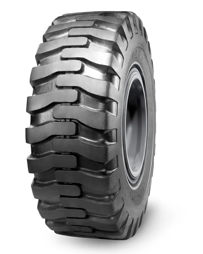 E-2/L-2 bias OTR tyre with off-road tread pattern, showing self-cleaning grooves and wide section width