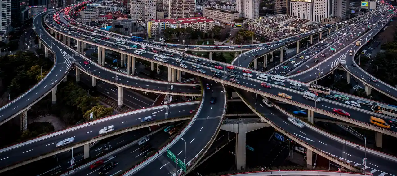 Multi level highway interchange in Shanghai busy with traffic at dusk
