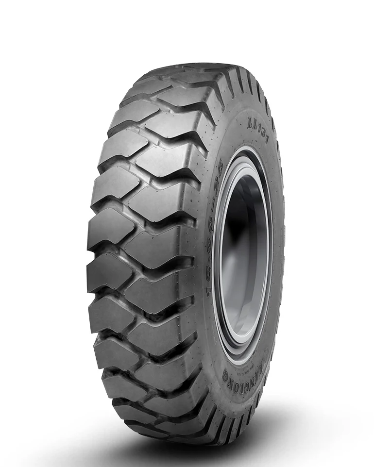 LL131(E-3) bias OTR tyre mounted on a rim, showing deep tread pattern and large overall diameter