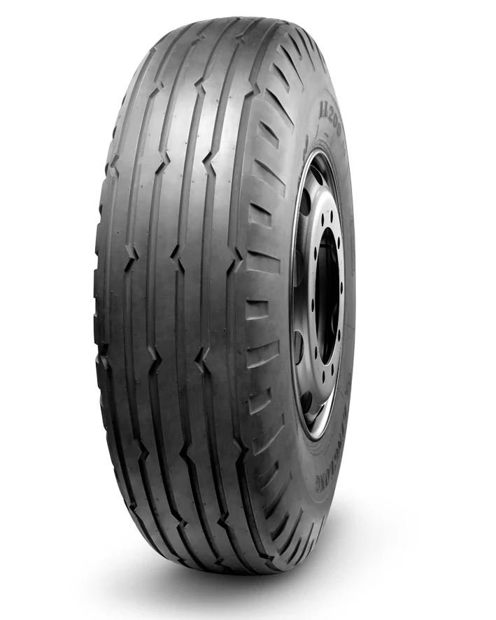 LL200 bias OTR tyre on a gravel road delivery vehicle with lateral grip tread pattern and reinforced sidewall