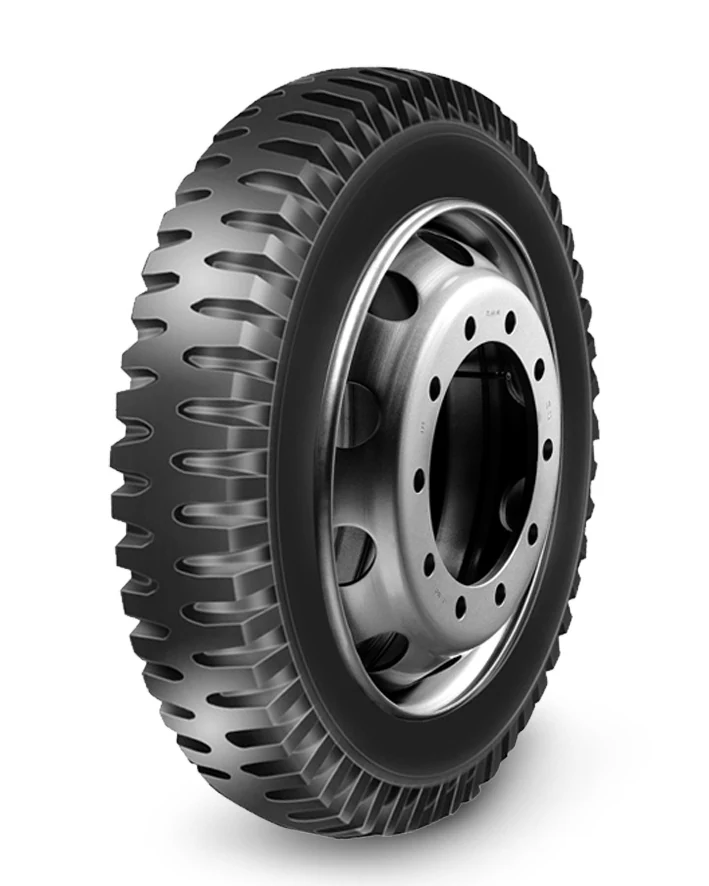 LL38 bias agricultural tyre with block tread pattern and reinforced sidewall, mounted on a rim