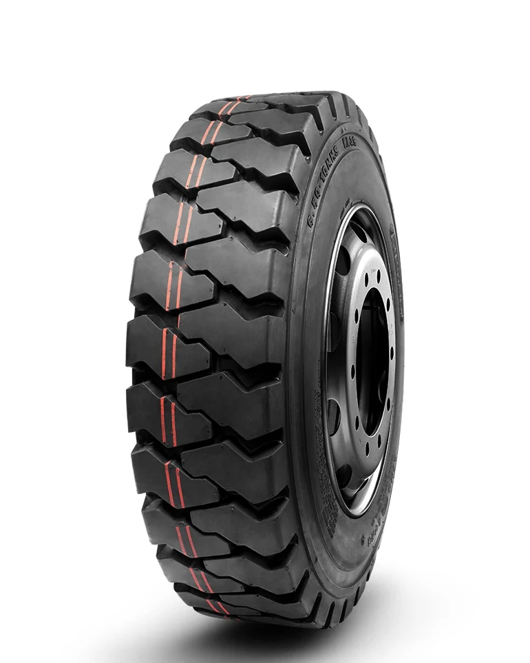 LL39 industrial tyre with block tread pattern and reinforced sidewall, mounted on a wheel rim
