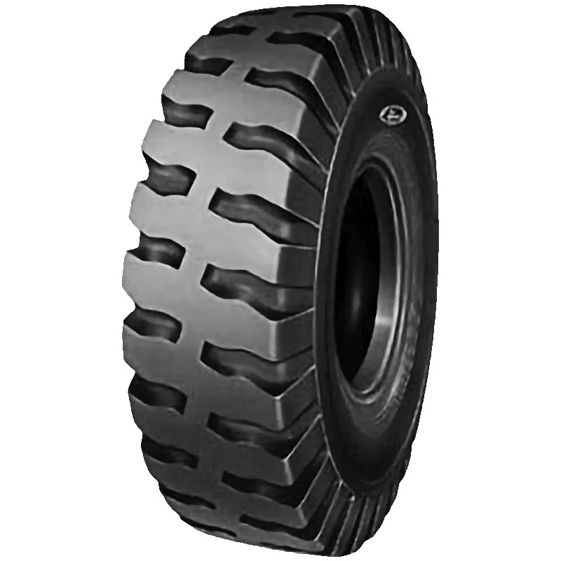 LL56(E-3) bias OTR tyre mounted on a large dump truck rim, showing tread pattern and self-cleaning grooves