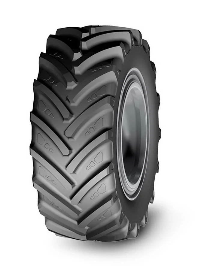 LR650 radial agricultural tyre with deep tread pattern and wide section width on a farm tractor wheel