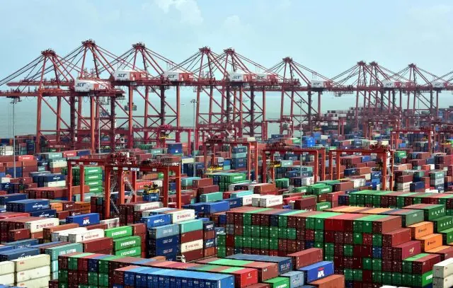 Container terminal with stacked containers and gantry cranes